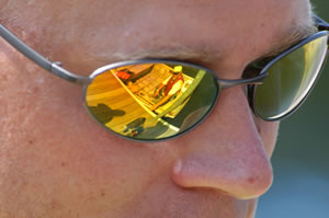 Reflection in man's sunglasses