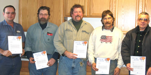 5 men holding awards