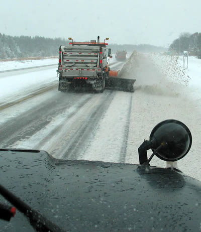 Snowplows on road