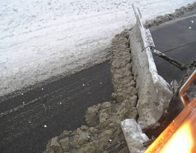 Snowplow back blade in action