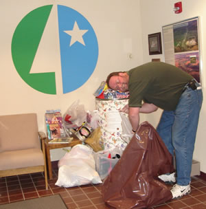 Man putting toys in bag