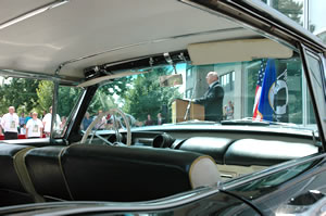 Man seen through windshield