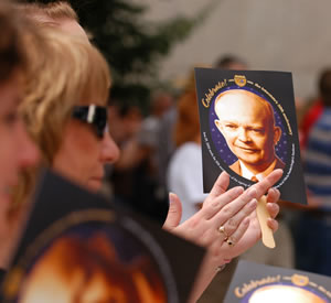 Woman holding photo fan of Ike