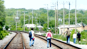 Kids crossing rail track
