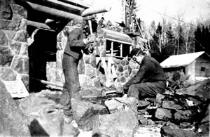 2 men cutting stone for rest area