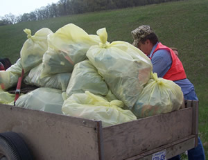Truck loaded with bags of trash