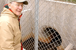 Floyd Laumann visits a storm drain inlet site near Hwy 5