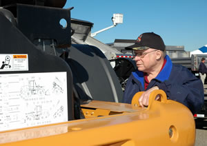 Man looking at maintenance vehicle