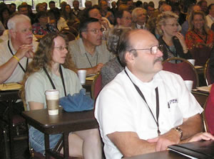 Conference attendees watching presentation