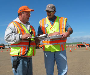 2 men in safety vests