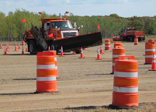 Snowplow drives through obstacle course