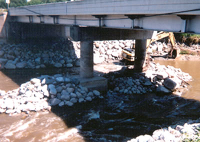 Rocks surround bridge piers