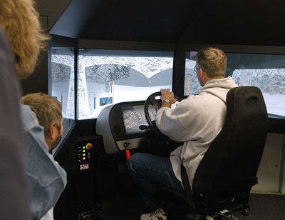 Man in a snowplow simulator