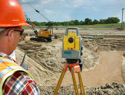 Man, 2 women surveying utility work for Hwy 212