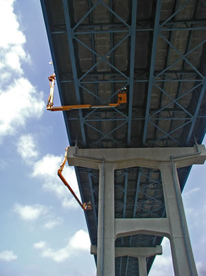 Bridge inspectors under a bridge
