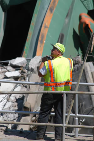 Mn/DOT worker photographs bridge