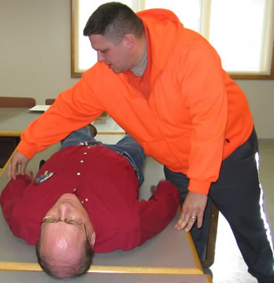 2 men practicing medical training