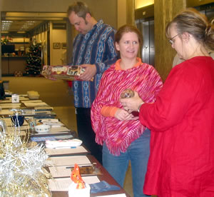 3 people at silent auction