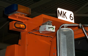 Orange truck with mounted laser technology