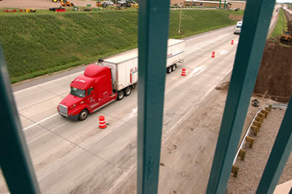 Semi-trailer truck seen from an overpass