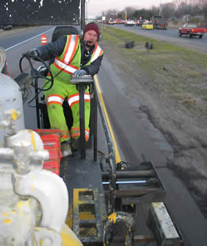 Man striping Hwy 36