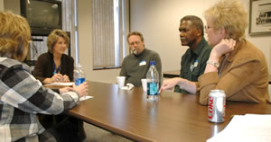 5 people at conference table