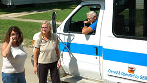 3 people, transit bus