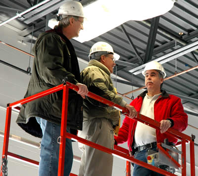 3 men on a platform