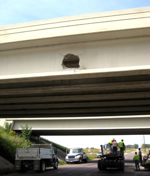 Bridge with hole punched in side