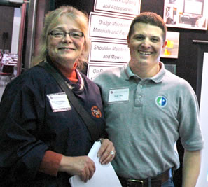 Woman, man at expo booth