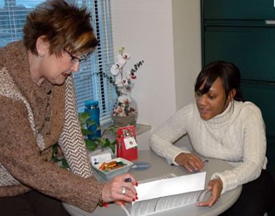 2 women discussing work