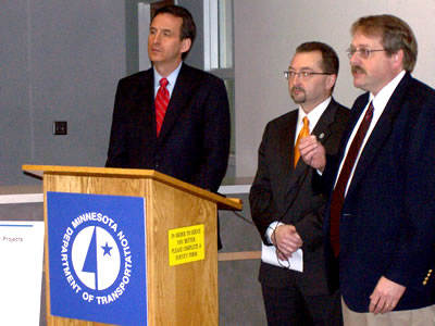 3 men at news conference