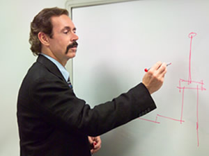 Scott Bradley writing on white board