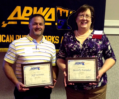 Photo of Jeff Streeter and Bev Farraher receiving awards 