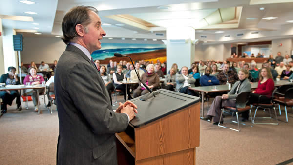 Commissioner Zelle speaking to employees