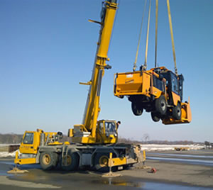 Trackless machine being lifted into air