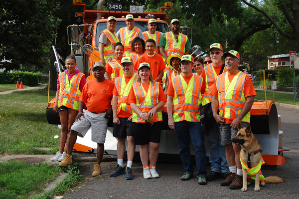 African-American Employee Resource Group pose in front of MnDOT truck