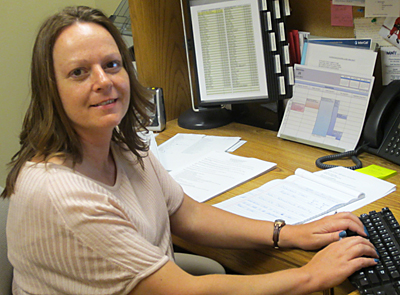 Doris Degenstein working at her desk