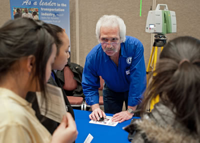 Engineer talking to students