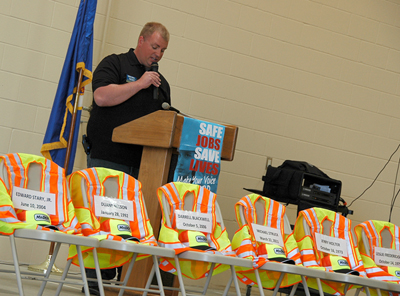 Chris Hanson speaks at lectern