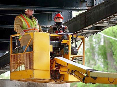 Photo of Jennifer Zink inspecting a bridge