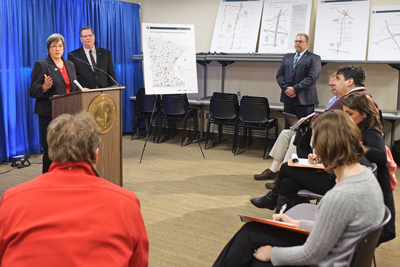 Photo of Sue Mulvilhill and Tom O'Keefe answer questions during construction kickoff news conference.