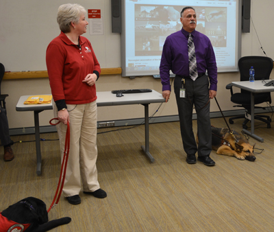 Laurie Carlson, Ken Rodgers and two service dogs