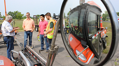 Photo of Bob Strommen demonstrating equipment at MnROAD Open House.