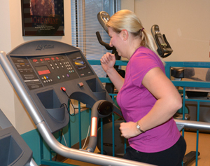 Michelle Huettl works out in the Central Office workout facility