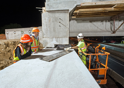 Photo of Nancy Daubenberger and Dave Herzog at Larpenteur Avenue Bridge project.