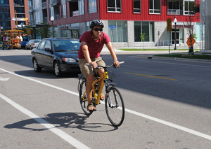 Photo of a bike rider in bike lane.