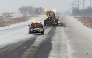 Photo of a roadgrader plowing snow in District 8.