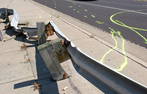 Photo of a smashed guardrail.