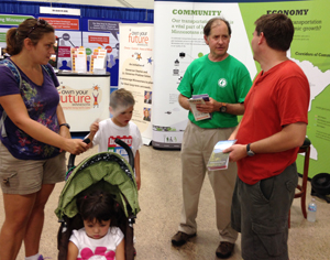 Photo of Commissioner Zelle at MnDOT State Fair booth.